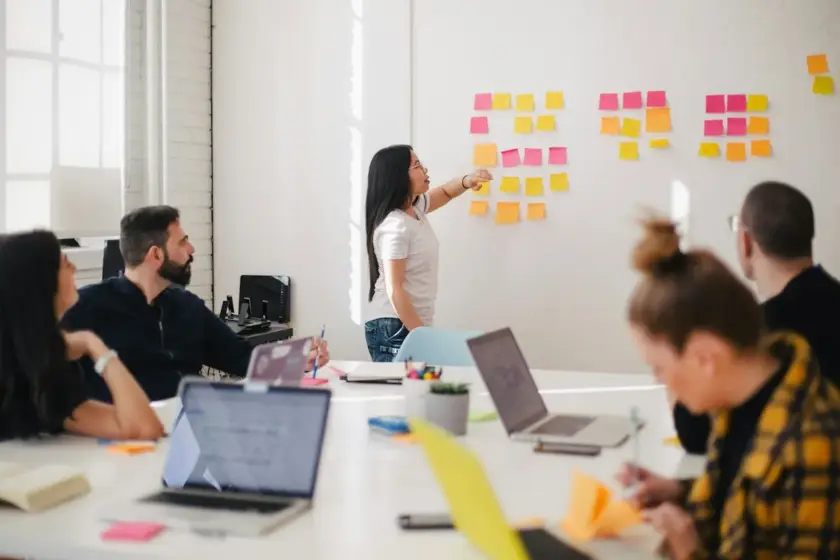 Digital marketing team planning strategy on a whiteboard