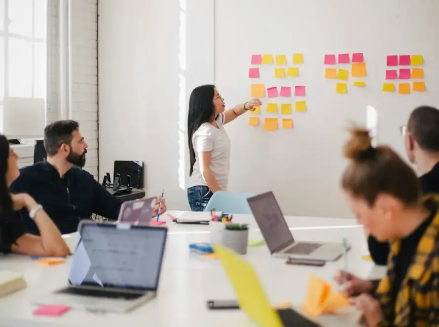 Digital marketing team planning strategy on a whiteboard
